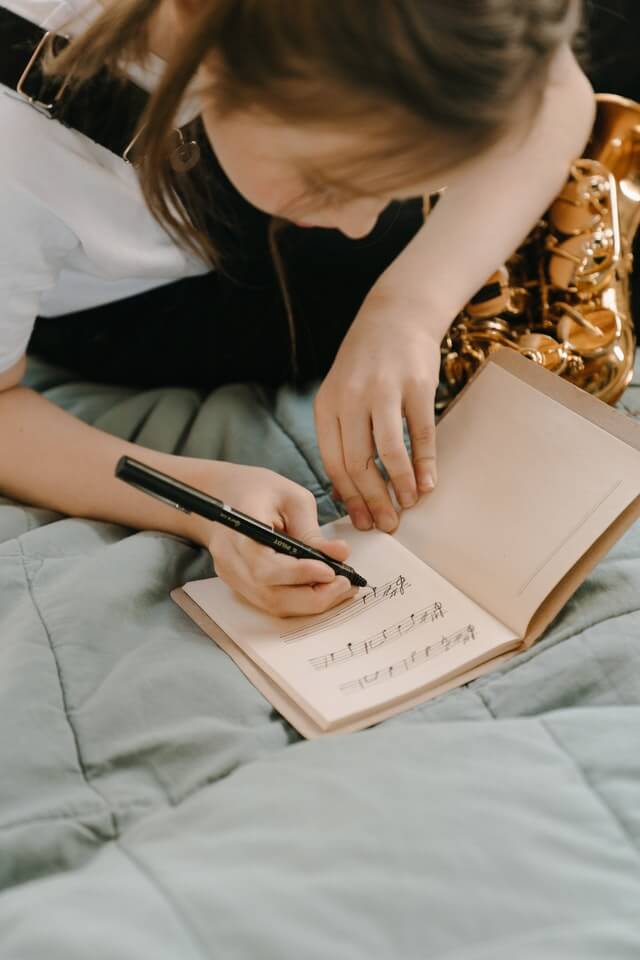 Girl writing Music